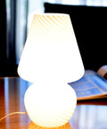 Tall Mushroom Glass Table Lamp With Romantic 12 Inch Vintage Swirl Mid Century Design on wooden table near open book