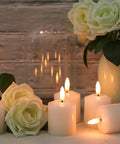 Six Pack Flameless Pillar Candles With 3D Flame, Battery-Operated Real Wax LED Votive Candles on table with roses