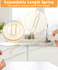 Set Of Seven Invisible Plate Hangers For Wall Display Featuring Stainless Steel Hooks In Four Six Eight Ten And Twelve Inch Sizes No Sweat Setup To Show Off Your Decor Built Tough, showing a spring plate hanger in use.