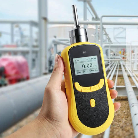 Handheld Carbon Monoxide Detector 0 to 1000 ppm CO Gas Tester with LCD display, shown in use at an industrial site