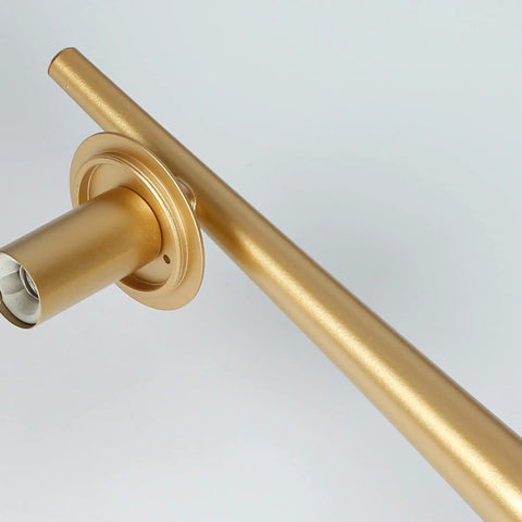 Close-up of gold arm detail on Gold Vanity Light Fixture For Bathroom Over Mirror With Four Lights, Clear Globe Glass Shades.