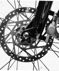 Heavy Duty Aluminum Alloy Disc Brake Caliper Pair With Badass Stopping Power For Trail Blazing And City Cruising Snappy Install And Dependable Hand Grip close-up on bike wheel with disc brakes.