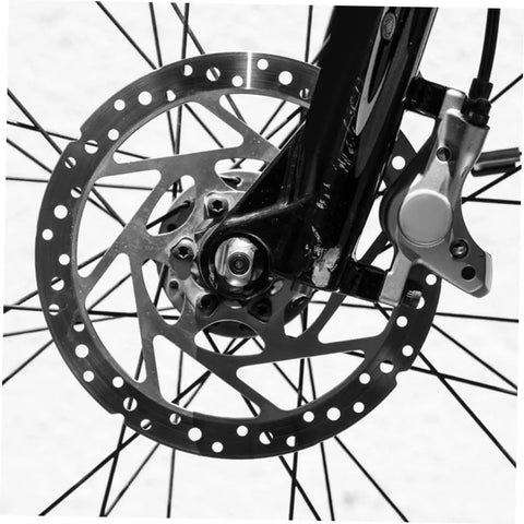 Heavy Duty Aluminum Alloy Disc Brake Caliper Pair With Badass Stopping Power For Trail Blazing And City Cruising Snappy Install And Dependable Hand Grip close-up on bike wheel with disc brakes.