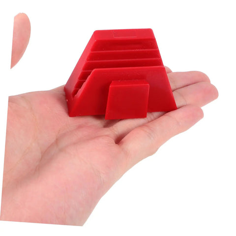 Hand holding red plastic component of the 12 Piece Modular Wrench Organizer Tray for Workbenches Space Saving Tool Holder