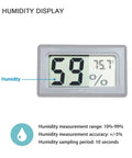 Close-up of Four Pack Mini Digital Temp And Humidity Meters With Probes, showing humidity display reading 59% and temperature 75.7°F