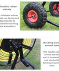 Totally Rock Solid Heavy Duty Garden Hose Reel Cart With Smooth Rolling Wheels features inflatable rubber wheels and a rocking handle.