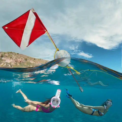 Snorkelers swimming near Must Have Dive Flag And Float Kit For Snorkel And Scuba, 14 By 18 Inch Nylon Flag With Tough Stiffener Rod
