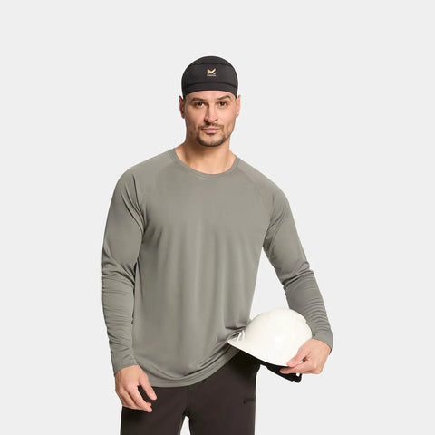 Man wearing Cooling Helmet Liner That Cools Instantly When Wet With UPF 50 Sun Protection under gray shirt holding hard hat