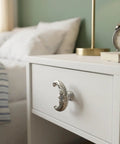 Four Piece Crescent Moon Cabinet Knobs Vintage Retro Drawer Pulls With Moody Carved Faces For Gothic Boho Kitchen And Vanity Hardware on white nightstand.