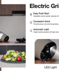 Hand using Rechargeable Electric Salt And Pepper Grinder Set with USB Charging, adjustable coarseness, LED light in greige.