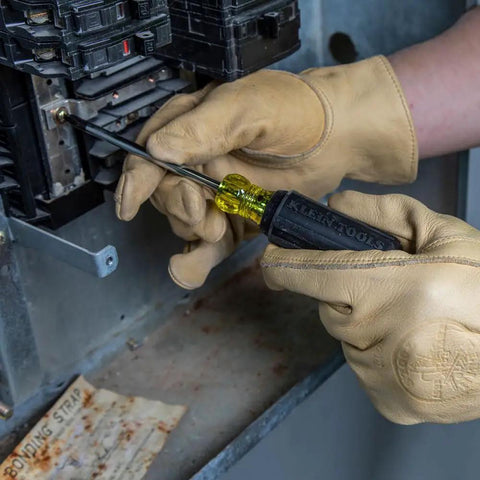 USA Made Four Piece Slotted And Phillips Screwdriver Set With Cushion Grip Handles And Tip Ident in use on electrical panel