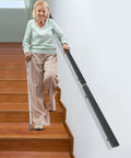 Premium Flush Handrail Set Stainless Steel Wall Mounted Indoor Outdoor Stair Railing With Heavy Duty Mounts Built Like A Tank And Rock Solid For Daily Projects, installed beside stairs with elderly user.