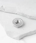 Premium Heavy Duty 4 Pack 5/16 24 Unf Stainless Steel Hex Flange Nut on a white surface for Harley Davidson exhausts.
