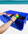 Person's hands reaching into a Rock Solid Heavy Duty 18 Gallon Plastic Tote With Handy Hinged Flip Lids Stackable Warehouse Storage Bins Pack Of Three