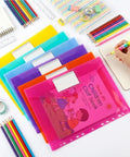 Six Pack Plastic Binder Pockets Folders with Transparent Pockets and Label Window A4 Size arranged with school supplies