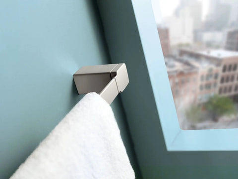 90 Degree 18 Inch Towel Bar In Brushed Nickel on light blue wall with towel hanging, slick modern bathroom accessory with concealed mounting