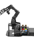 Robotic arm kit with Arduino-compatible control board, side view, black metal frame
