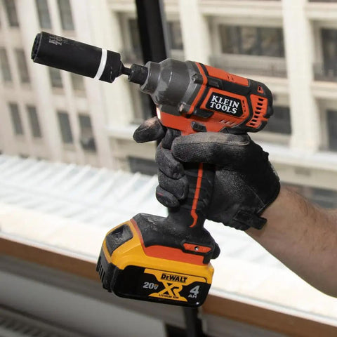 Impact Socket Set For One Half Inch Drive Metric 12 Point Deep Sockets Self Adjusting On power drill in gloved hand