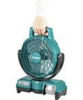 Person holding a teal 18V LXT Cordless Oscillating Fan 9-1/4 Inch Quiet Desk and Jobsite Fan with three-speed settings and tilt options.
