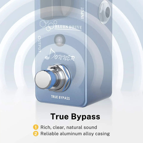 Close-up of blue Overdrive Guitar Pedal With Warm And Hot Modes Blues Drive Vintage Style Tone For Pedal Boards True Bypass Circuit Delivers Classic Tube Overdrive From Gentle Breakup To Screaming Leads, emphasis on true bypass footswitch and logo.