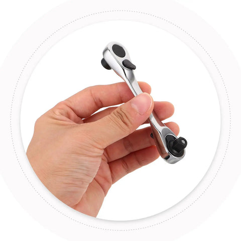 Real Deal Mini Double Ended Socket Ratchet Wrench With A Sweet Quick Direction Flip For Cranking Hex Fasteners In Those Awkward Tight Squeezes Around The Garage Shed held in hand.