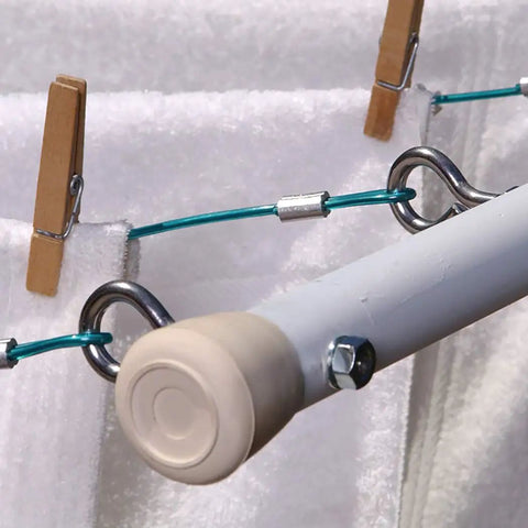 Eight Piece Eye Bolts With Nuts Set For Hanging And Tie Downs Five Sixteenth Inch By Three And One Quarter Inch Steel Zinc Plated Fasteners used with cables in a utility setup.
