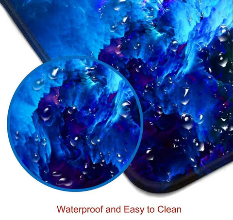 Ultra Wide Galaxy Desk Pad For Gaming And Work Non Slip Rubber Base Mouse Pad 31.5x11.8 Inch With Stitched Edges close-up of waterproof surface