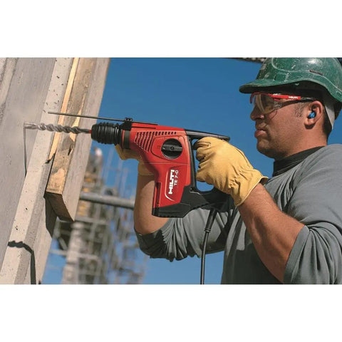 Worker using 6-Piece Carbide Drill Bit Set With Solid Carbide Head For Less Wear And Insane Precision on concrete wall