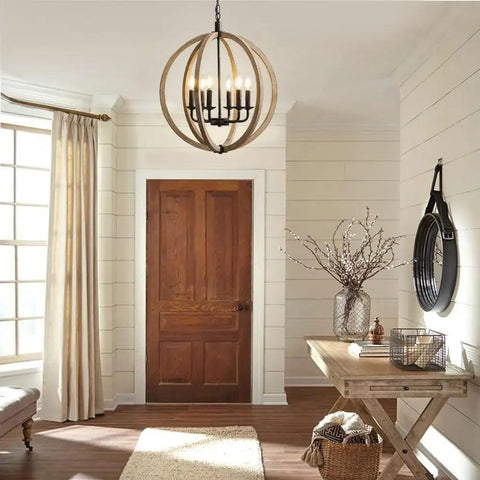 Orb 6 Light Farmhouse Chandelier In Brown Wood Finish With Globe Design Hanging in a Cozy Foyer