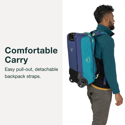 Person carrying collapsible wheeled carry on duffel with backpack straps