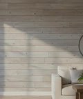 Kickback Beachwood Water Based Wood Stain For Interior And Exterior Use That Brings A Laid Back Coastal Flair To Your Deck With No Voc Drama And A Natural Sun Washed Look Perfect For Weekend Crews And DIY Enthusiasts on a coastal wood wall in a bright living room.