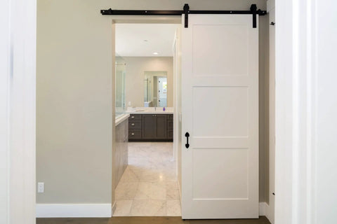 One Way Soft Close Mechanism For Sliding Door System With Flat Bar Track In Black Finish supports doors up to 176 lb, installed view