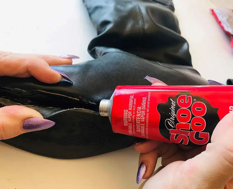 Do It All Shoe Adhesive And Sealant, 3.7 Fl Oz, Waterproof Black For Boots And Shoes applied to black leather boot sole