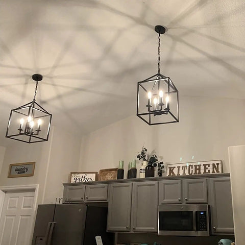 Farmhouse Black Pendant Light Lantern Chandelier For Kitchen Island Foyer Dining Room And Hallway Industrial Style Four Light Fixture With E12 Sockets Measures 17 By Eleven Point Eight Inches No Glass To Clean And Easy Ceiling Mount.