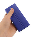 Close-up of a blue Two Pack Playpen Rod Connector Kit for Indoor Baby Fence Panels held in hand