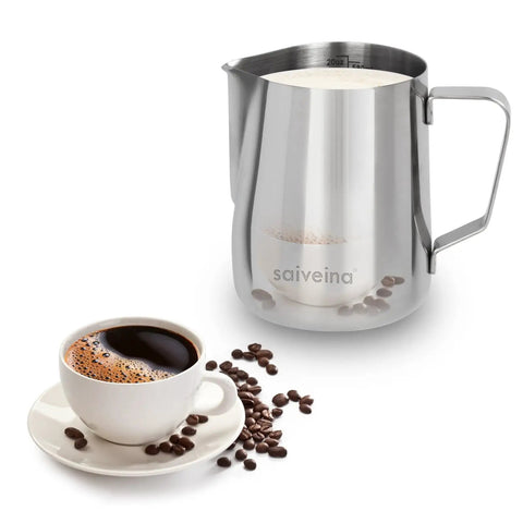 Barista Grade Stainless Steel Milk Frothing Pitcher 20oz 600ml For Espresso Machines And Latte Art Dishwasher Safe Rust Proof Easy To Clean Perfect For Cappuccino And Milk Foam next to a cup of coffee with scattered beans