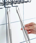 Two Pack 12-Inch Kitchen Tweezers Set hanging on hook, showing extra long stainless steel fine tweezer tongs for flipping and garnishing.