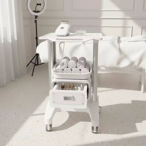 Straight Up Perfect Beauty Salon Cart Featuring Smooth Rolling Trolley Pull Out Drawer And Roomy Top Tray For Cosmetics with towels and equipment.