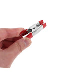 12 Pack Heavy Duty Metal Spring Clamps Kit For Woodworking Pros And DIY Gurus Offering Insane Grip Power For Crafts Dress Fitting Garlands And Household Projects You Need Right Now red metal spring clamp held in hand