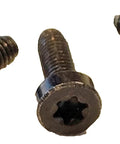 Screws: three black Torx pan-head bolts, close-up view for steering column cover/shroud