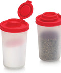 Moisture Proof Salt And Pepper Shaker Set For Camping Picnics Travel Outdoors Kitchen Lunch Boxes Transparent With Red Lids Airtight Plastic Dispenser Pack Of 2 Spice Shakers, two shakers shown