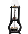 Real Deal Cold Brew Drip Tower With Adjustable Copper Flow Valve, Premium Hand Blown Glass Ice Coffee Brewer with visible brew setup.