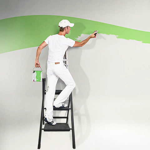 Man painting wall on 3 Step Folding Ladder Step Stool With Wide Anti Slip Pedal Portable Sturdy Steel Frame Built To Last 200 Lbs Capacity