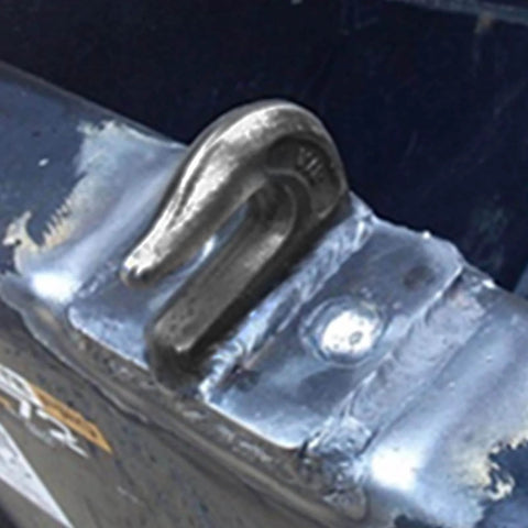 5/16 Inch Weld-On Grade 70 Grab Hook installed on flatbed trailer, heavy-duty steel, showing secure welding attachment