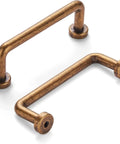 Eight Pack Two And A Half Inch Antique Brass Cabinet Handles And Drawer Pulls With Screws For Kitchen Cabinets And Bathroom Vanity Furniture Dresser Wardrobe Cabinetry Vintage Style Hardware, showing two brass handles.