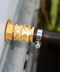 Garden Hose Adapter Female To Female 3/4 Inch GHT Brass Connector, Double Female Hose Fittings With Washers And PTFE Tape, Rustproof, No Fuss Easy Install For Outdoor Watering And DIY Plumbing. Brass connector attached to hose on outdoor fixture.