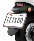 4 Pack Anti Theft Aluminum Alloy License Plate Screws For Front And Rear Mounting, installed on vehicle plate in bright orange color.