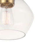 Close-up of Harrow 1 Light Semi Flush Mount Ceiling Light In Matte Brass With Clear Glass Shade, showing bulb and brass fixture.