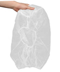 Hand holding a single 50 Pack Top Shelf Disposable Nonwoven Hair Net For Cleanrooms and Kitchen Sites in white fabric.