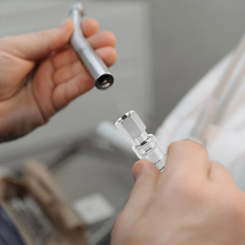 Heavy Duty Workhorse Stainless Steel Air Hose Coupler Quick Connect Pneumatic Fitting being fitted by hand in workshop.